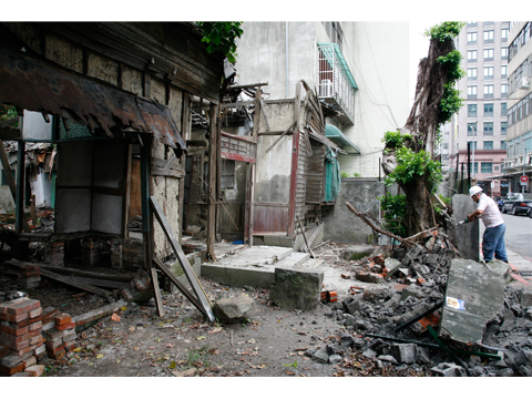 Removing the wall of a Ruined house,Qidong Street. Taipei 2008