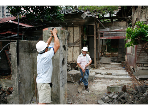 Removing the wall of a Ruined house,Qidong Street. Taipei 2008